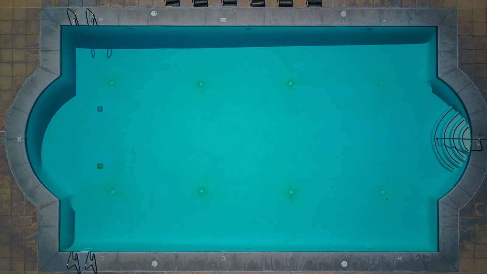 Inground pool vs above ground pool cost comparison for a backyard installation