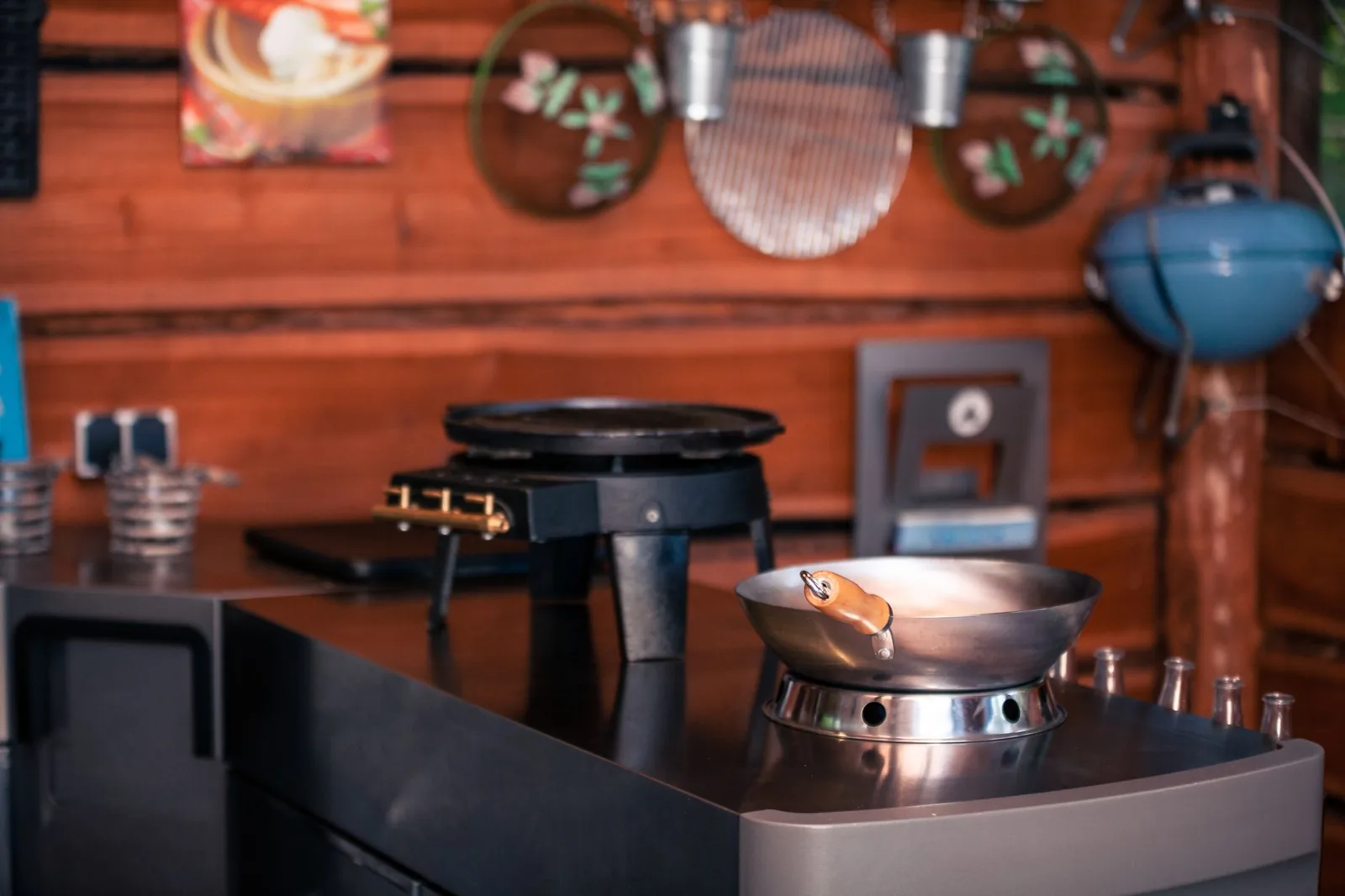 A budget backyard kitchen with a freestanding grill and simple prep counter